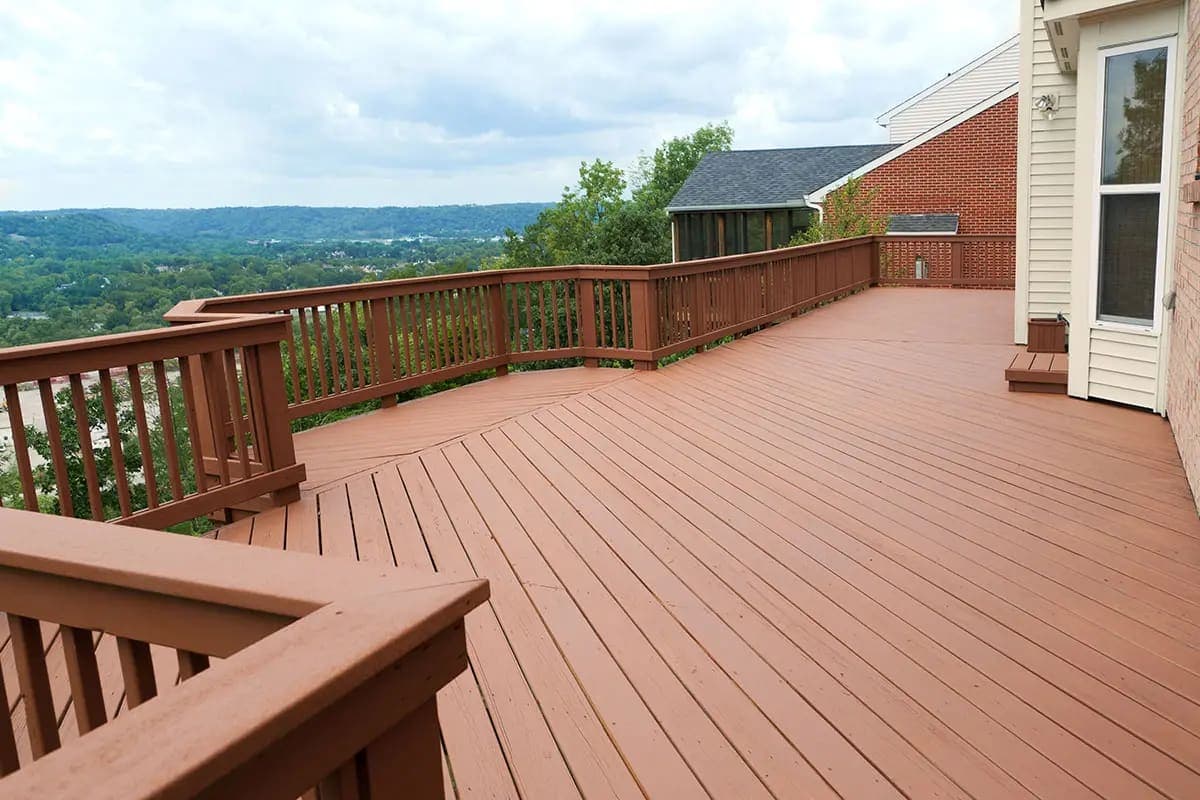 Wood railing around a large redwood deck